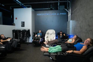 People receiving compression therapy in a modern facility with equipment